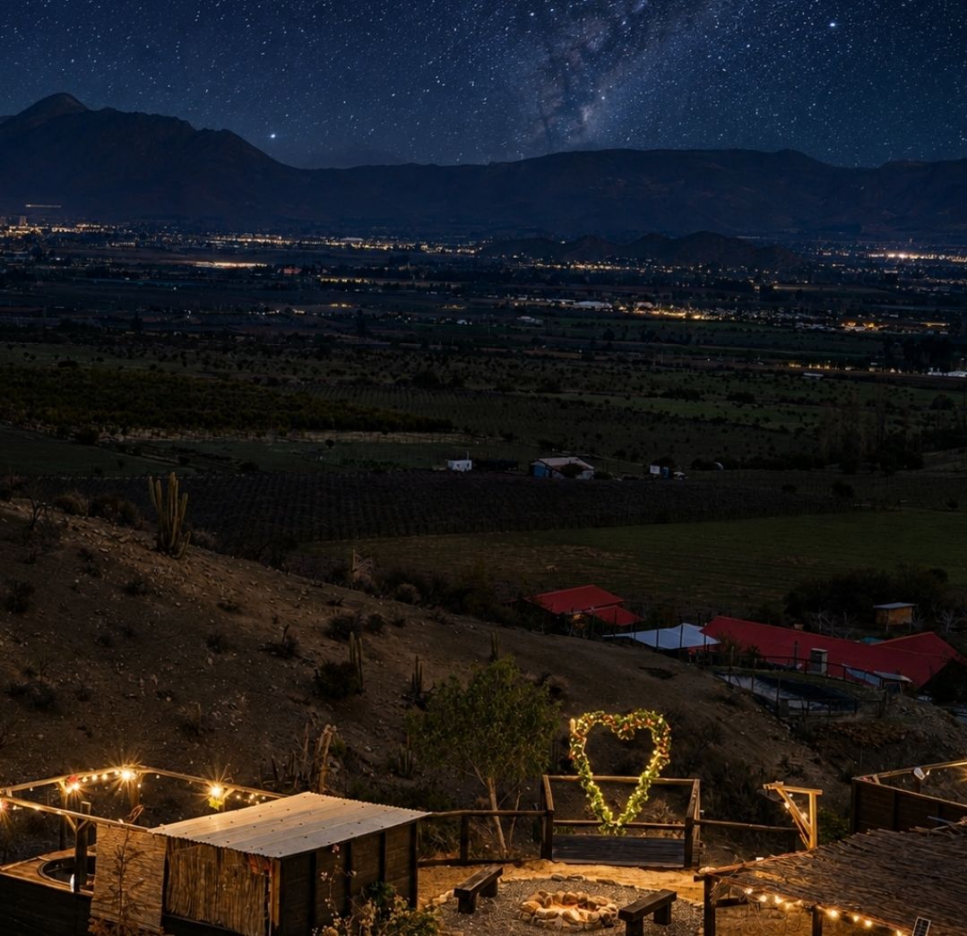 Cielo estrellado con la Vía Láctea sobre el valle